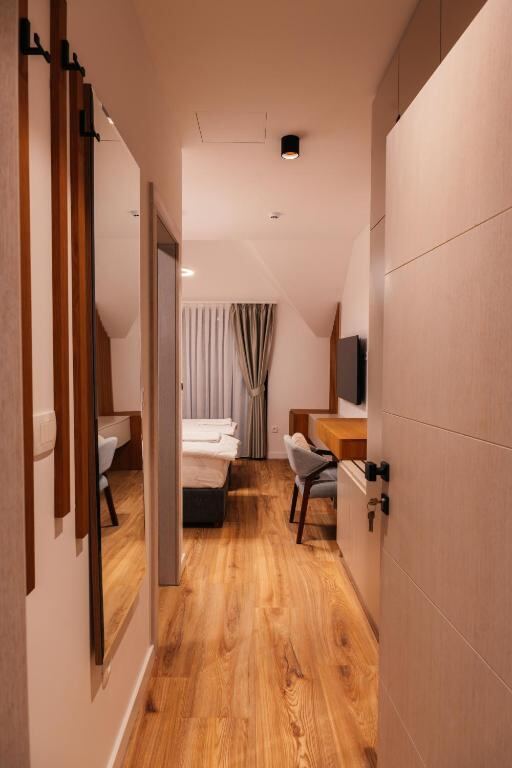 Corridor and room interior at Hotel Nordik